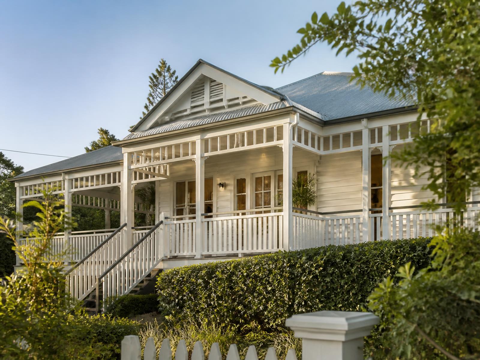 A Brisbane Queenslander home with a wide verandah in warm afternoon light